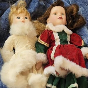 The 2 Christmas dolls are porsling dolls and the wedding one is plastic